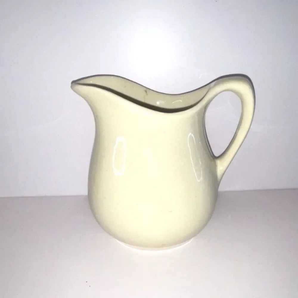 Beautiful vintage white stoneware pitcher; measures 6